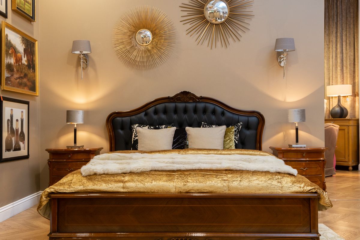 Luxuriously made bed with soft layered bedding