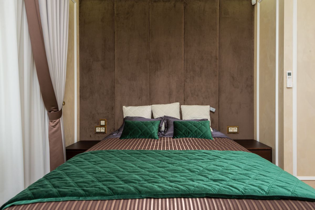 Neatly styled bedroom with coordinated bedding set