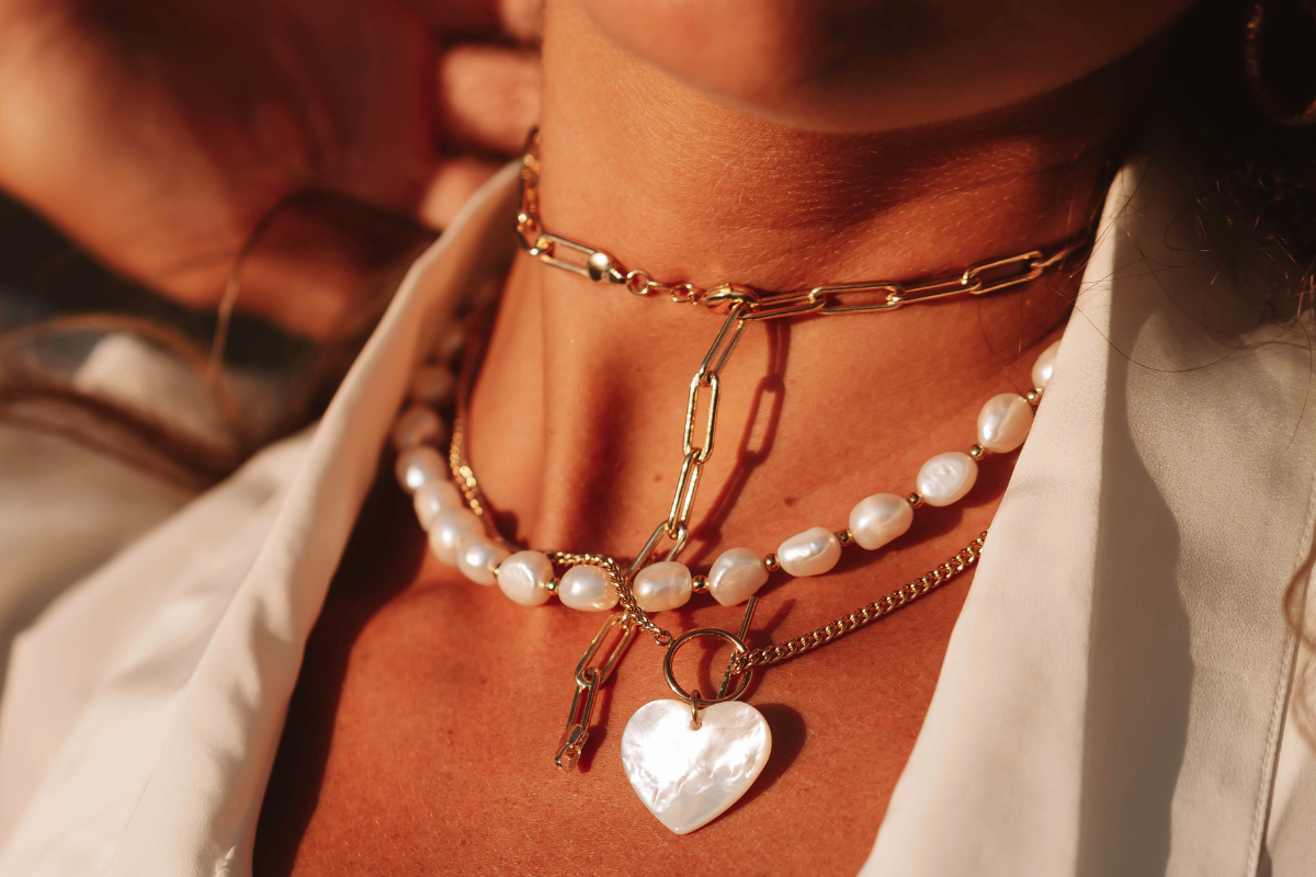 Layered necklaces as statement accessories that brighten casual and formal wear