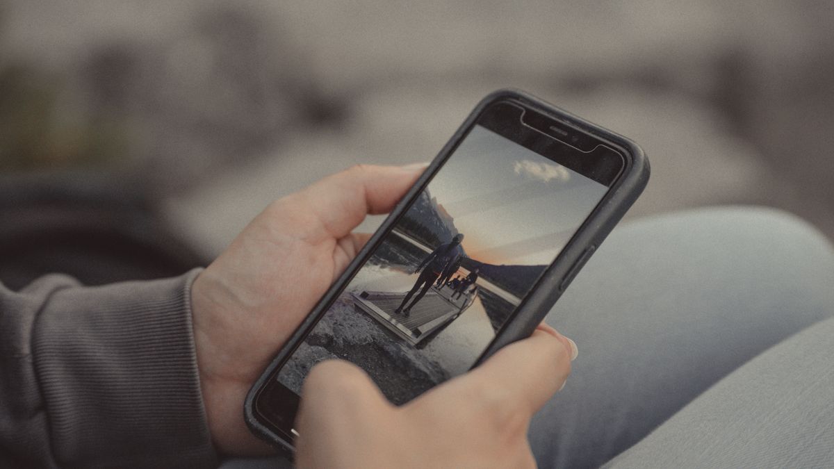 Phone held in both hands