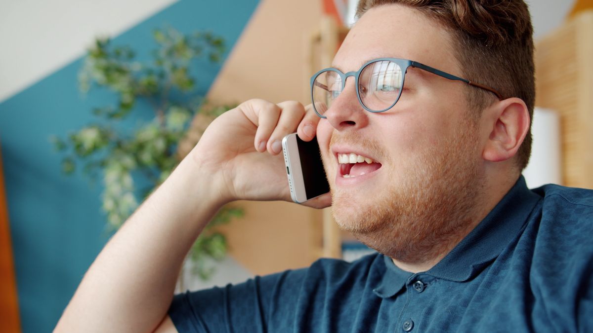 Man laughing on a call