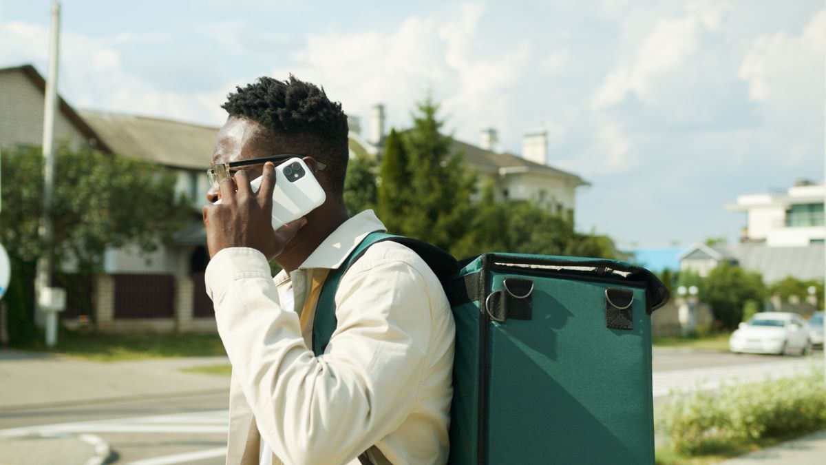 Courier on a call outdoors