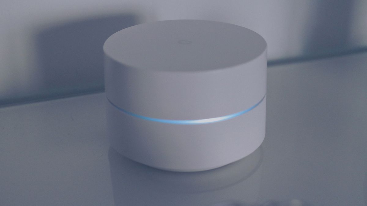 White mesh Wi-Fi unit on a shelf