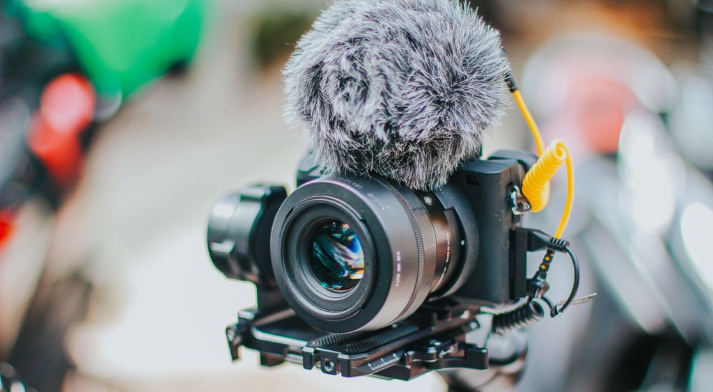 Video camera rig fitted with a shotgun microphone in close up